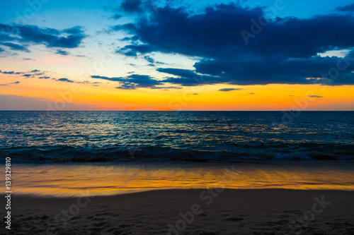 Sunset over the beach of ocean