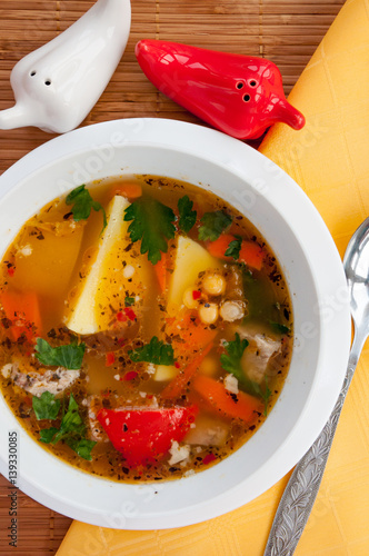 Beef Soup With Vegetables in a white plate photo