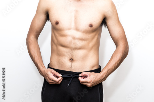 Muscle asian man showing on white background
