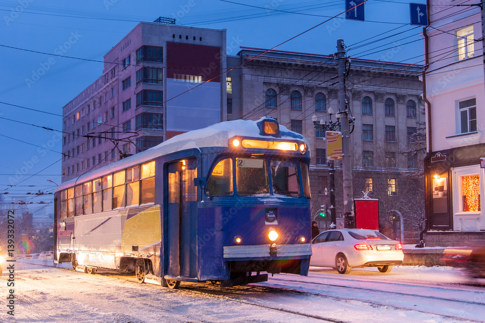 Obraz premium KHABAROVSK, RUSSIA - JANUARY 14, 2017: Old tram in the street of winter city of Khabarovsk