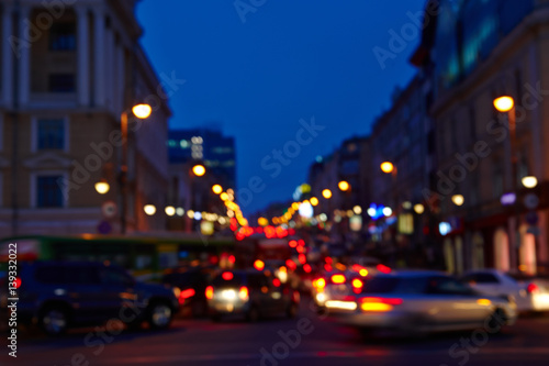Images of the city at night is blurred for a background texture abstract lights glow