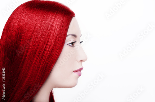 Beauty Girl with Long Straight Red Healthy Hair. 