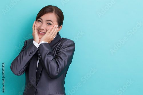 Shy businesswoman on isolated background