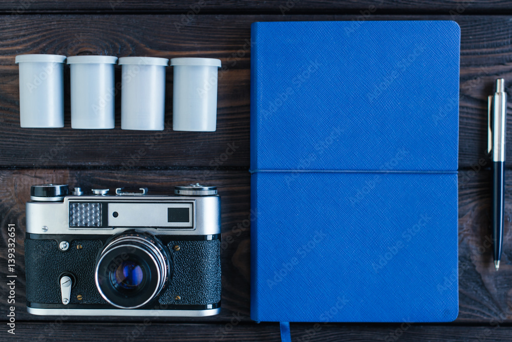 Camera Notepad Desktop of the photographer. Vintage camera, pen, Notepad, whatever you ...