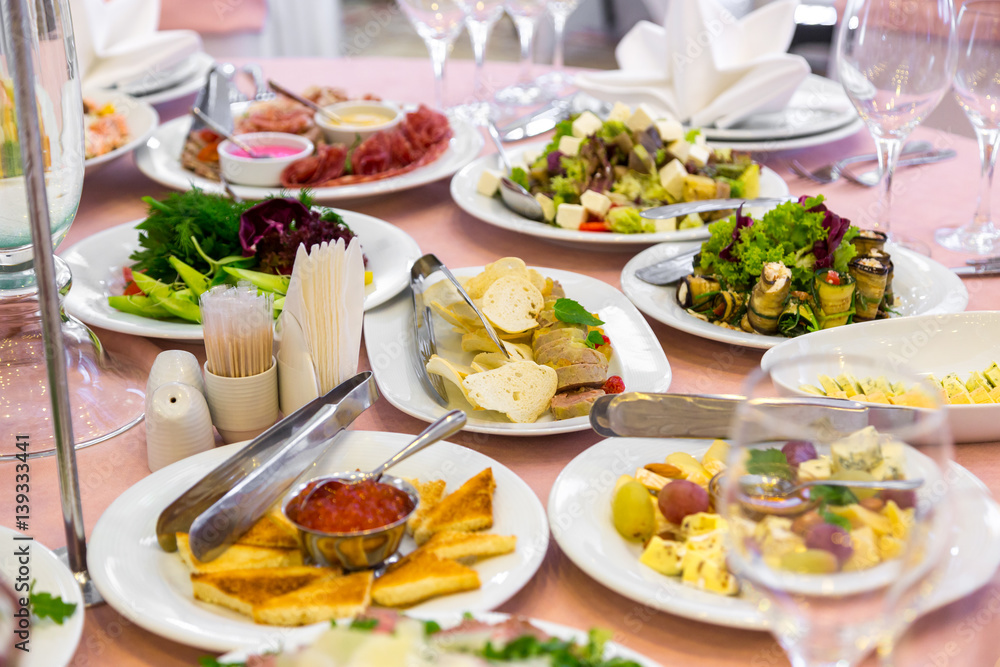 catering table set service with silverware, napkin and glass at restaurant before party catering table set service with silverware, napkin and glass at restaurant before party