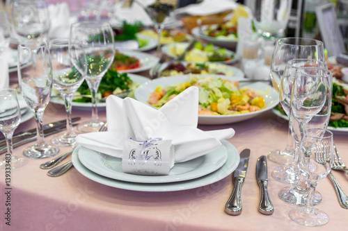 catering table set service with silverware  napkin and glass at restaurant before party