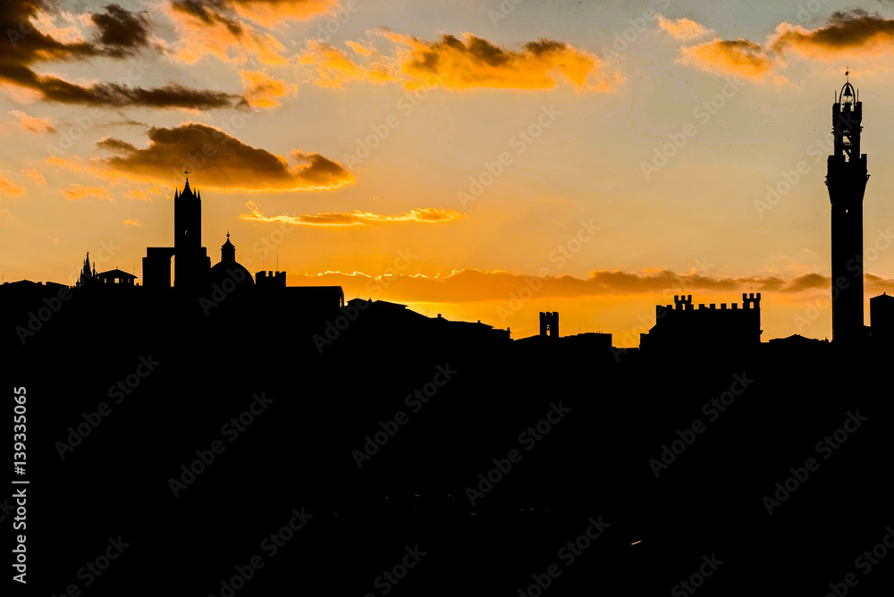 view of the city of Siena in Tuscany Italy, at sunset