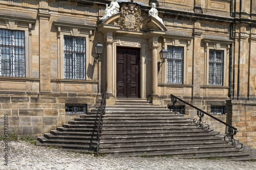 The historic entrance with stairs and ornamental railing © MiroslawKopec