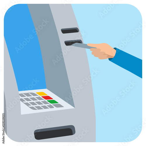 Hand inserting credit card into the atm slot