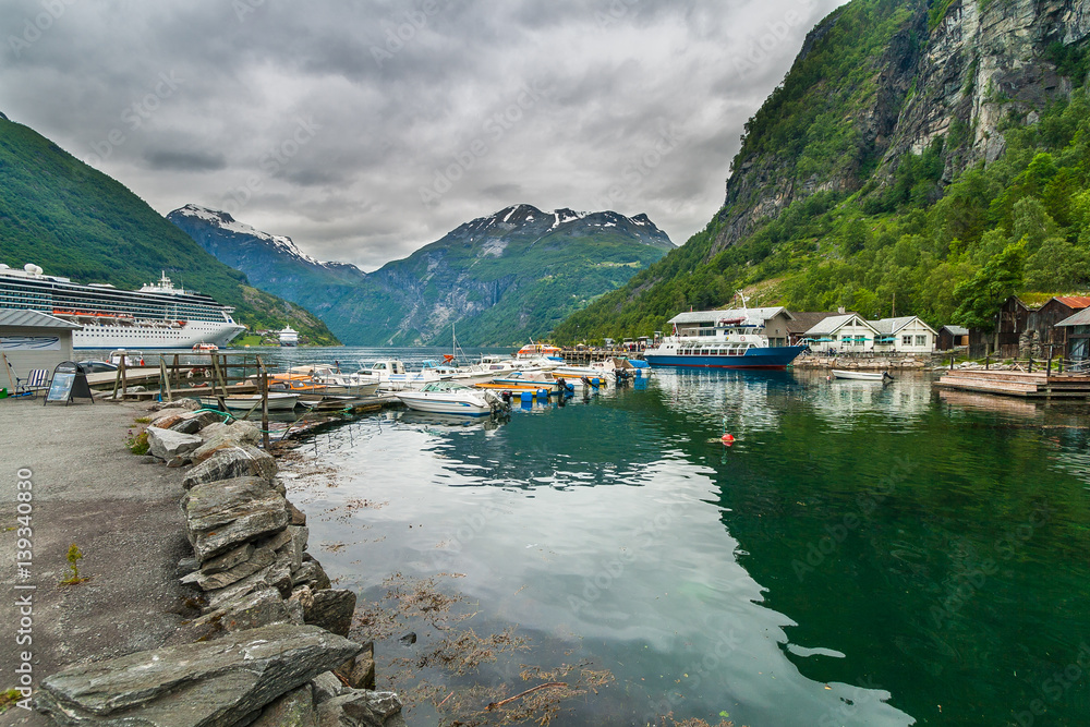 Cruise ship in Geirangerfjord, the most popular fjord in Norway. View from the marina. 