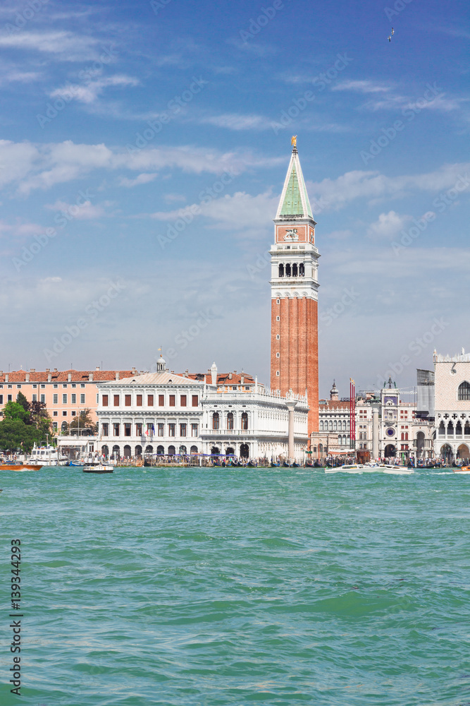 famous San Marco bell tower and waterfront at summer day, Venice, Italy