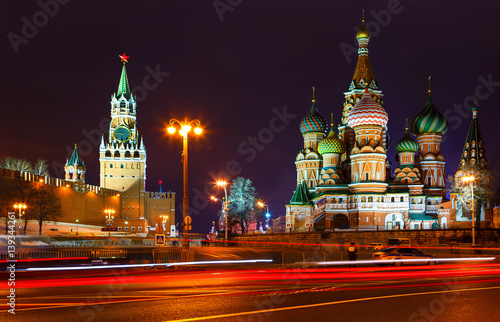 church and towers of Kremlin at night. view from Bolshoi Zamoskvoretsky bridge. Tracers from cars. Police car.