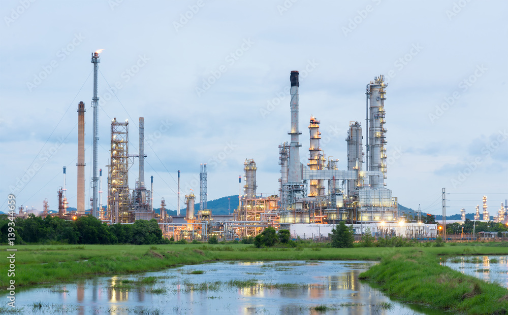 Oil refinery plant at sunrise with blue sky background