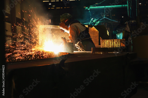 Schilderij op canvas Welder arc Gouging carbon electrode rods   with sparks and smoke