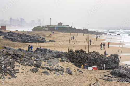 Line fishermen on Winklespruit beach near Amanzimtoti on KZN South Coast (Hibiscus Coast), South Africa