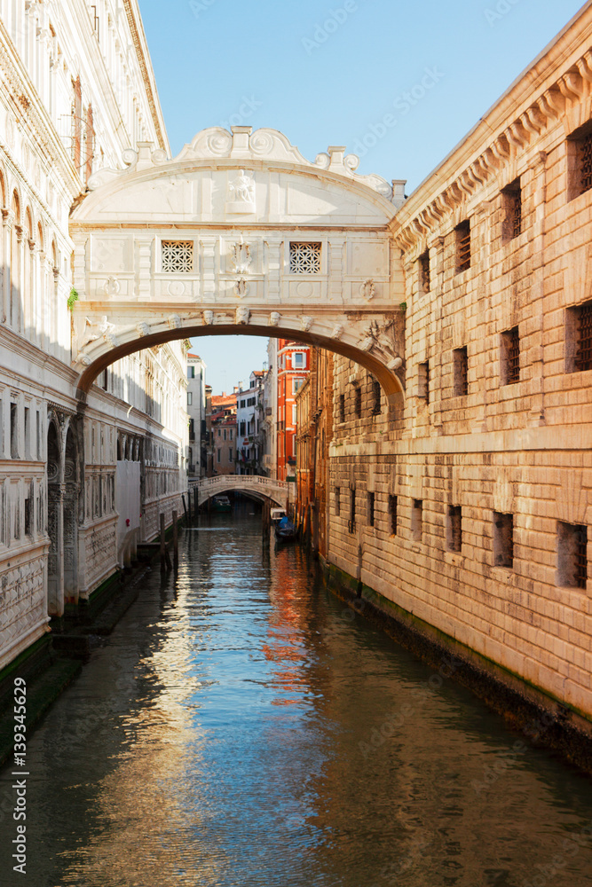 Bridge of Sighs over canal, sunny day in Venice, Italy
