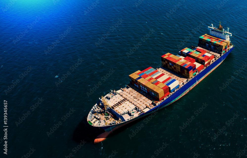 Fototapeta premium container ship in import export and business logistic.By crane ,Trade Port , Shipping.cargo to harbor.Aerial view.Top view.