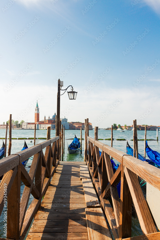 old wooden Pier and Gondolas embankment in the Grand Canal, Venice, Italy old wooden Pier and Gondolas embankment in the Grand Canal, Venice, Italy