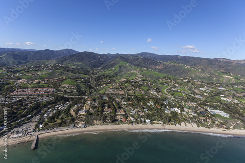 Aerial of shoreline and hil...