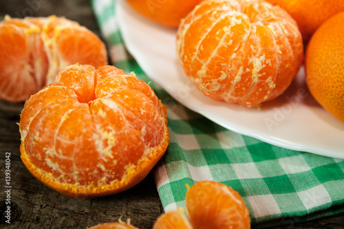 Fresh and tasty clementines on table and plate