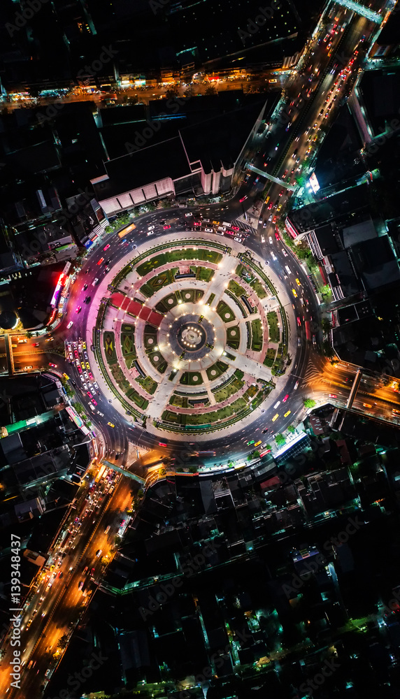 Road roundabout with car lots Wongwian Yai in Bangkok,Thailand. street large beautiful downtown at evening light. Aerial view , Top view ,cityscape ,Rush hour traffic jam Road roundabout with car lots Wongwian Yai in Bangkok,Thailand. street large beautiful downtown at evening light. Aerial view , Top view ,cityscape ,Rush hour traffic jam