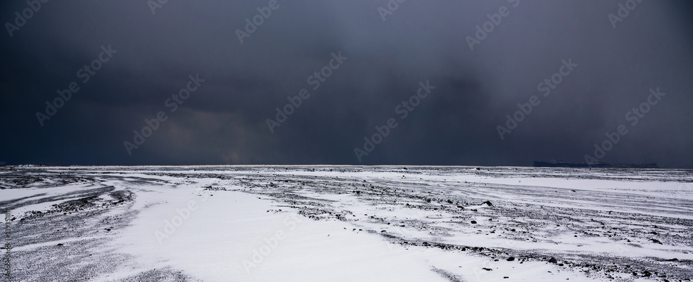 Storm approaching over volcanic field - breathtaking Iceland in winter - amazing landscapes, storms and blizzards - photographers paradise