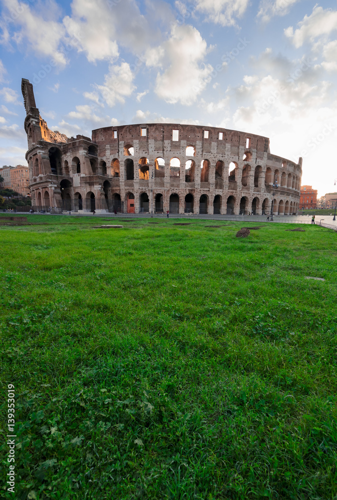 ruins of antique Colosseum in sunise lights, Rome Italy