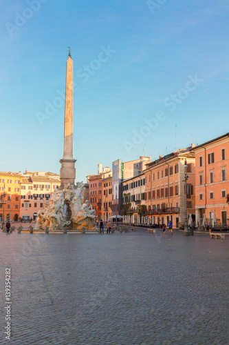 view of famous Piazza Navona with fountain of four ivers in Rome, Italy