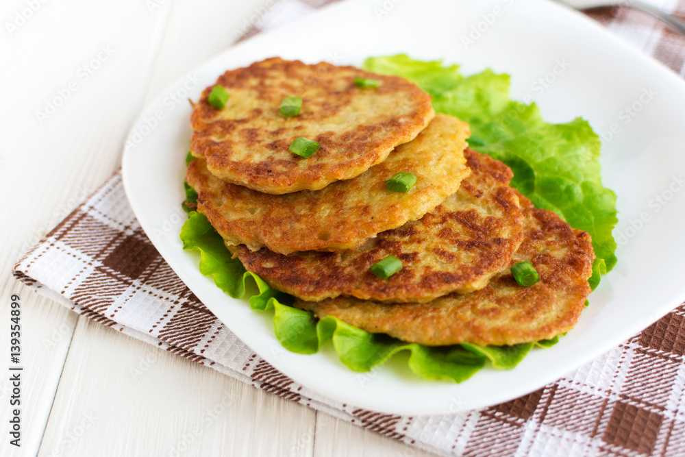 Fried potato pancakes on white background Fried potato pancakes on white background