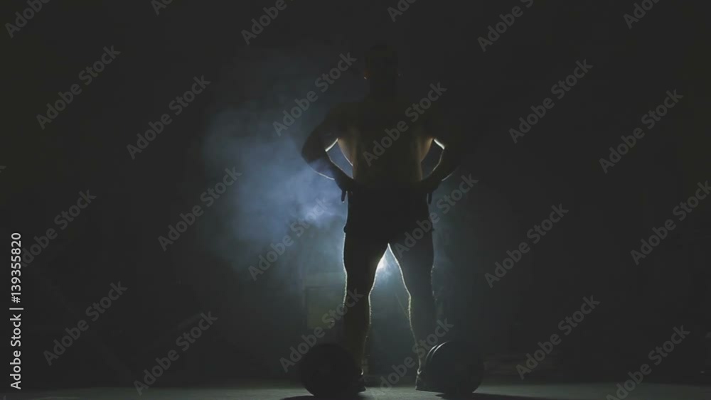 Bodybuilder posing back Bodybuilder posing back