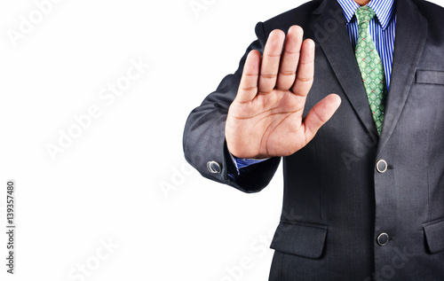 Business man stoping in black suit isolated on white background photo