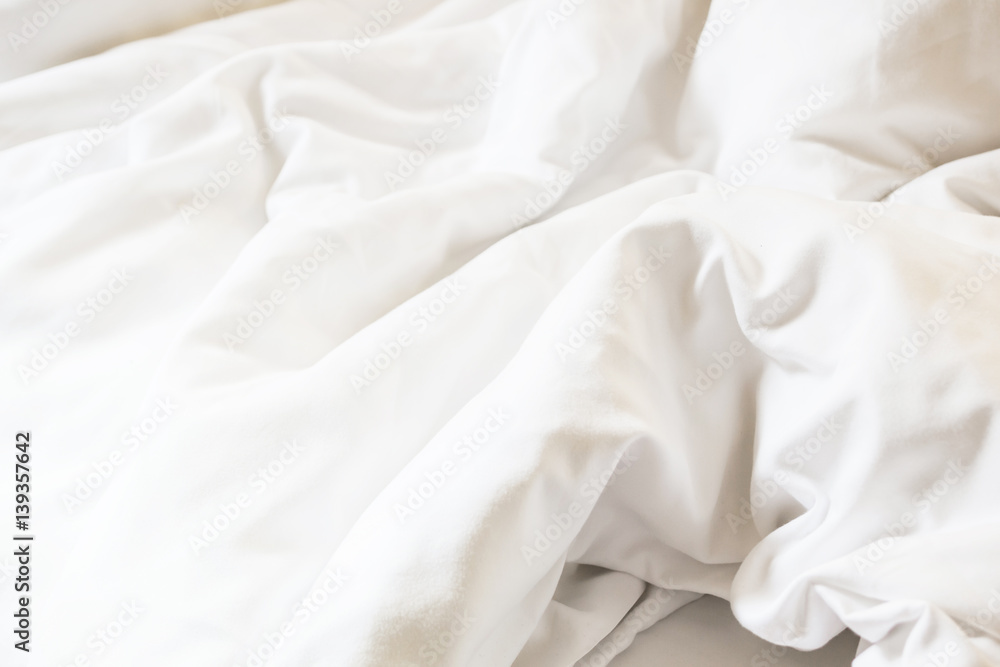 white pillow on bed and with wrinkle messy blanket in bedroom, from sleeping in a long night. white pillow on bed and with wrinkle messy blanket in bedroom, from sleeping in a long night.