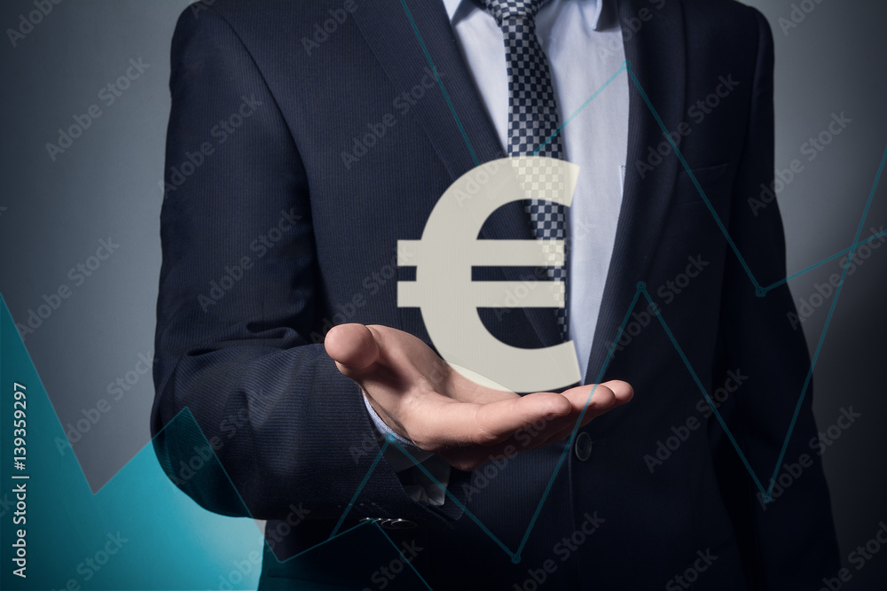 businessman holding currency symbol in hands. Hand holding euro symbol. businessman holding currency symbol in hands. Hand holding euro symbol.