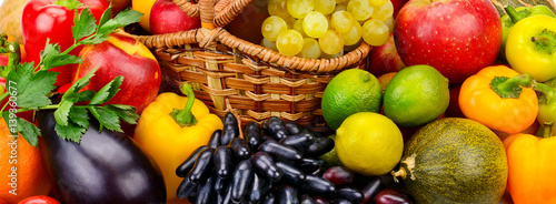 Basket with fresh fruits and vegetables 