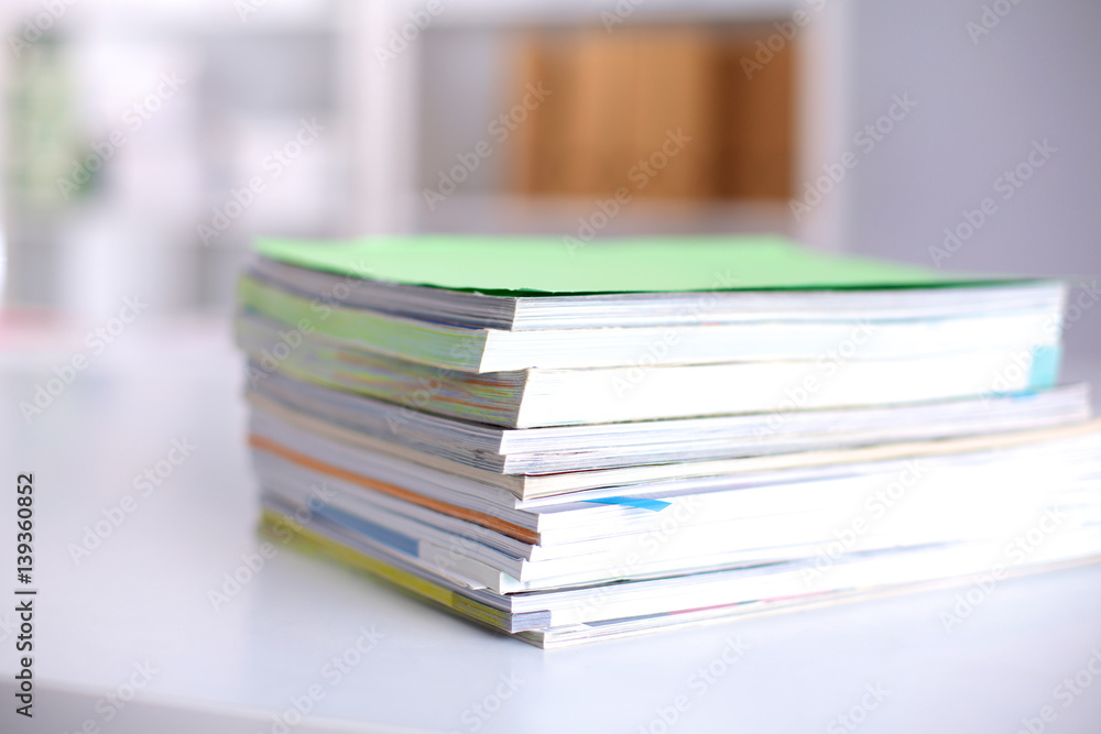 close up of stack of papers on white background close up of stack of papers on white background