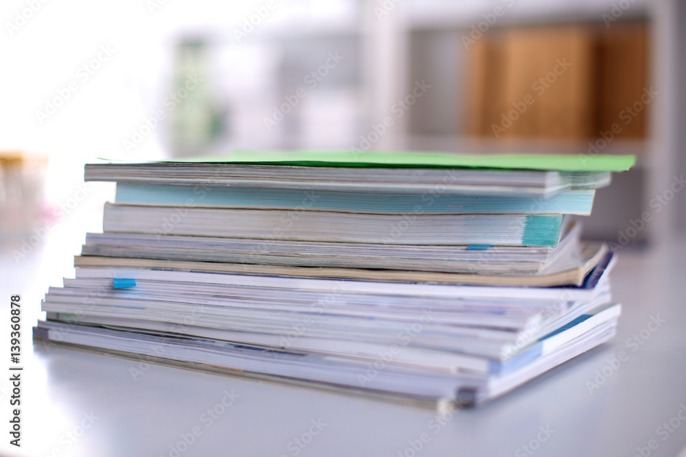 close up of stack of papers on white background close up of stack of papers on white background