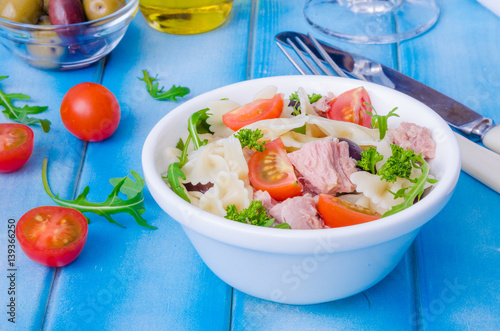 Pasta salad with tuna  olives  cherry tomatoes and arugula