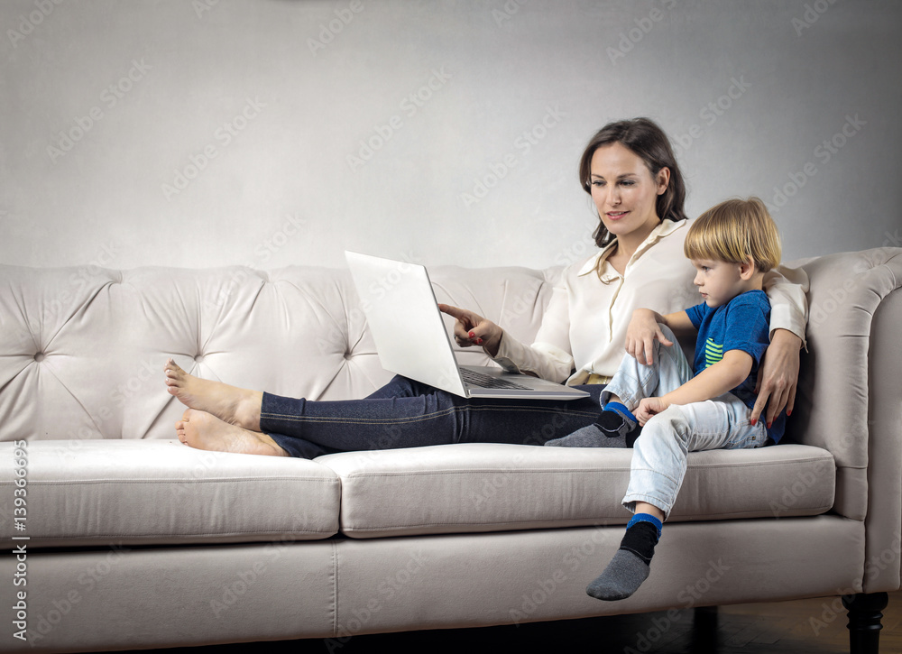 Obraz premium Mother and son using a pc