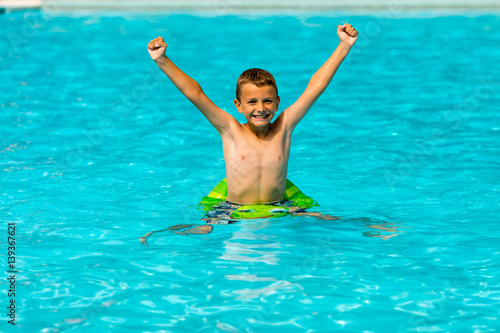 Smiling boy in swimming pool © Mikkel Bigandt