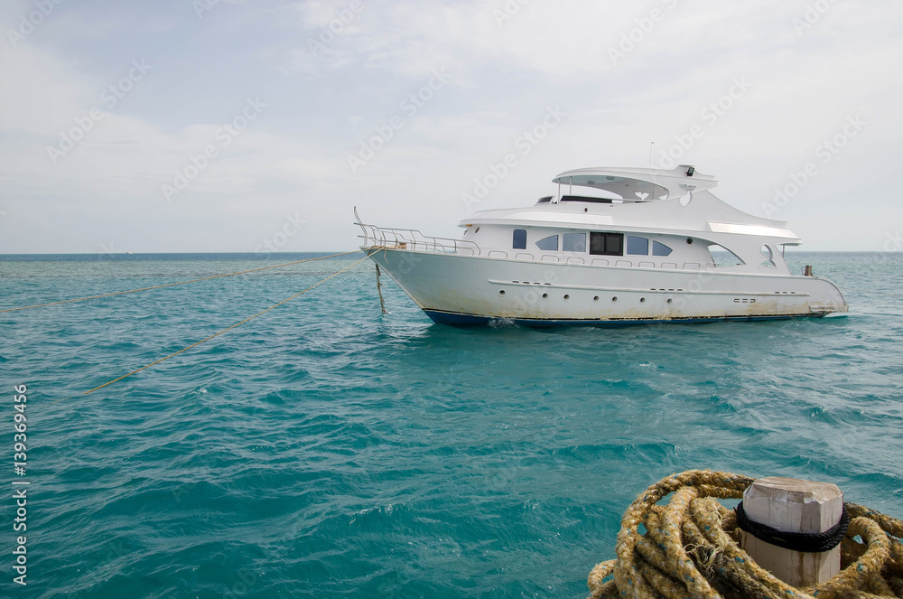 The boat is anchored in the sea The boat is anchored in the sea