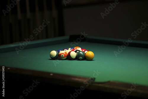 Pool balls on green pool table