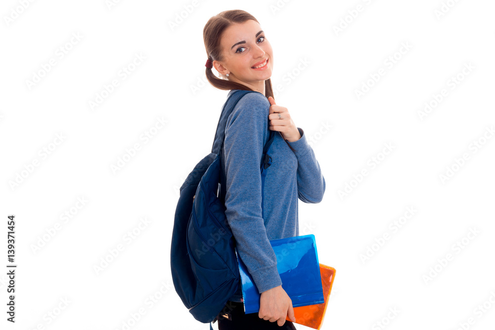 cute teen girl with pigtails stands sideways and holding a Briefcase ...