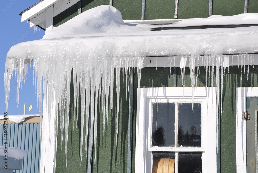 Fototapeta premium Icicles in front of the house