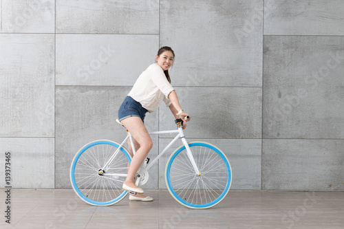 young pretty woman with bike