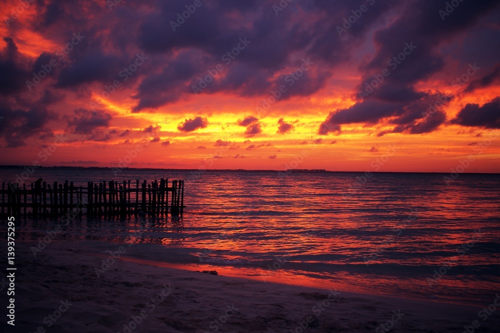 Sunset on the beach in Isla Mujeres, Mexico.
