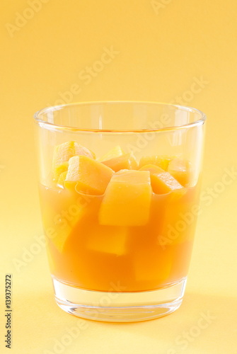 Wallpaper Mural cubes of mango pulp isolated on a yellow background Torontodigital.ca