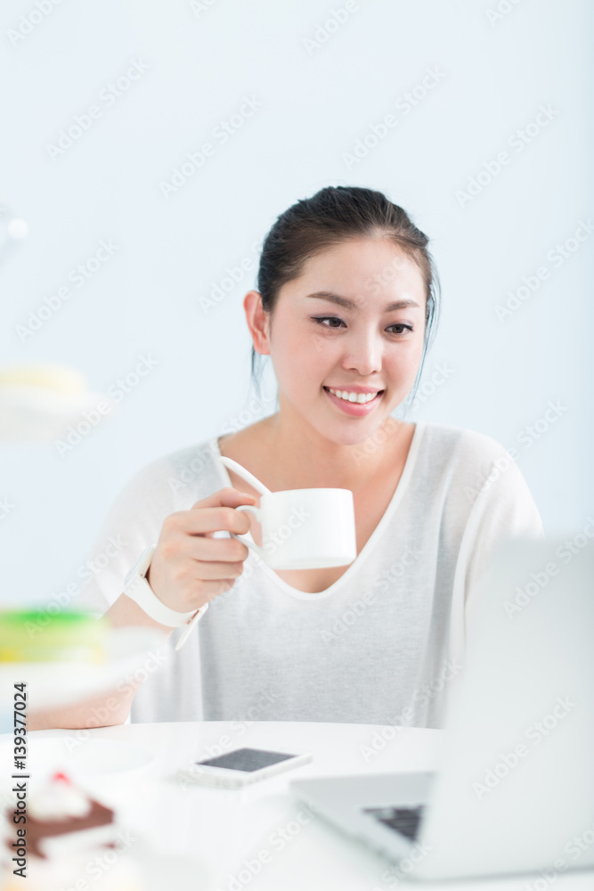 young pretty woman using laptop in office young pretty woman using laptop in office