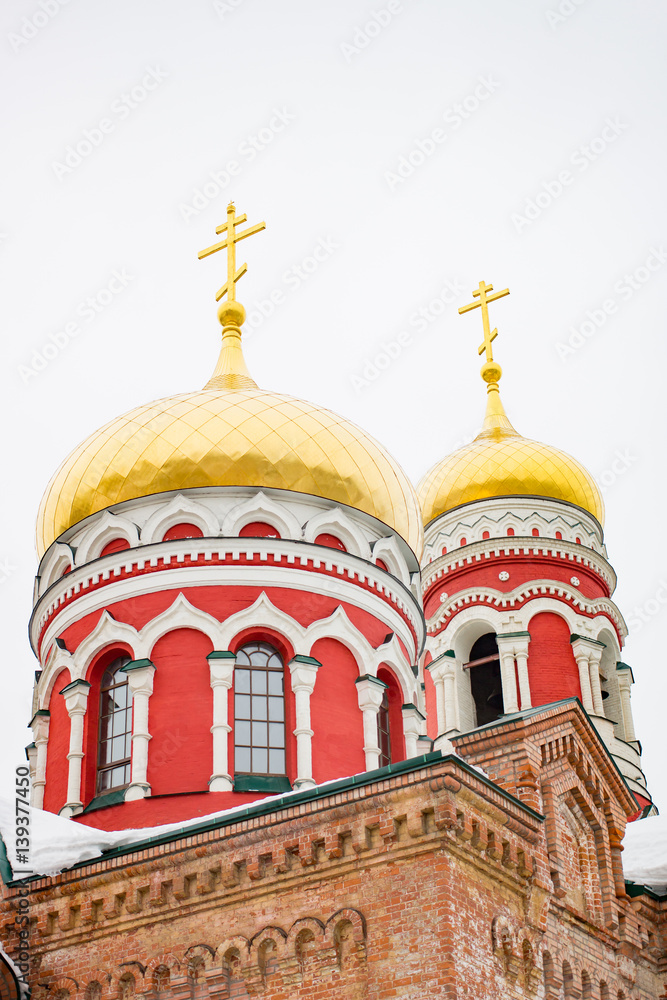 Golden Dome white church on the sky background