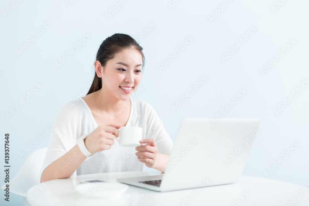 young pretty woman using laptop in office young pretty woman using laptop in office