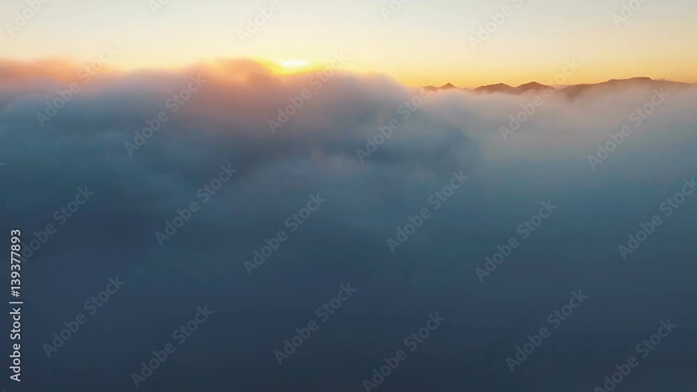 Flying in the clouds. Span in the copter through the clouds. Beautiful nature. Field and mountain Flying in the clouds. Span in the copter through the clouds. Beautiful nature. Field and mountain